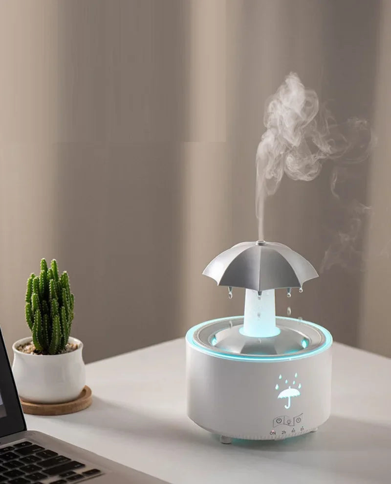 Máquina de aromaterapia con forma de paraguas giratorio y gotas de agua