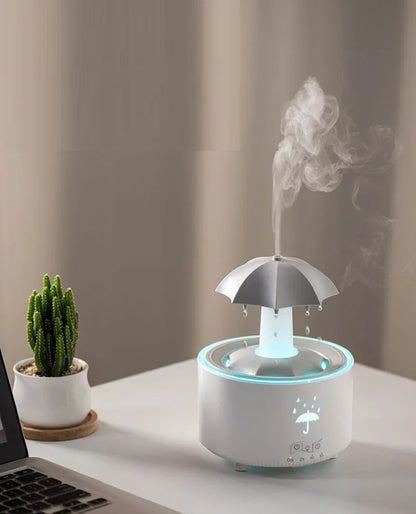 Máquina de aromaterapia con forma de paraguas giratorio y gotas de agua
